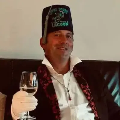 Chris Evans, who owns and runs the Blue Train, raising a glass in the carriage lounge