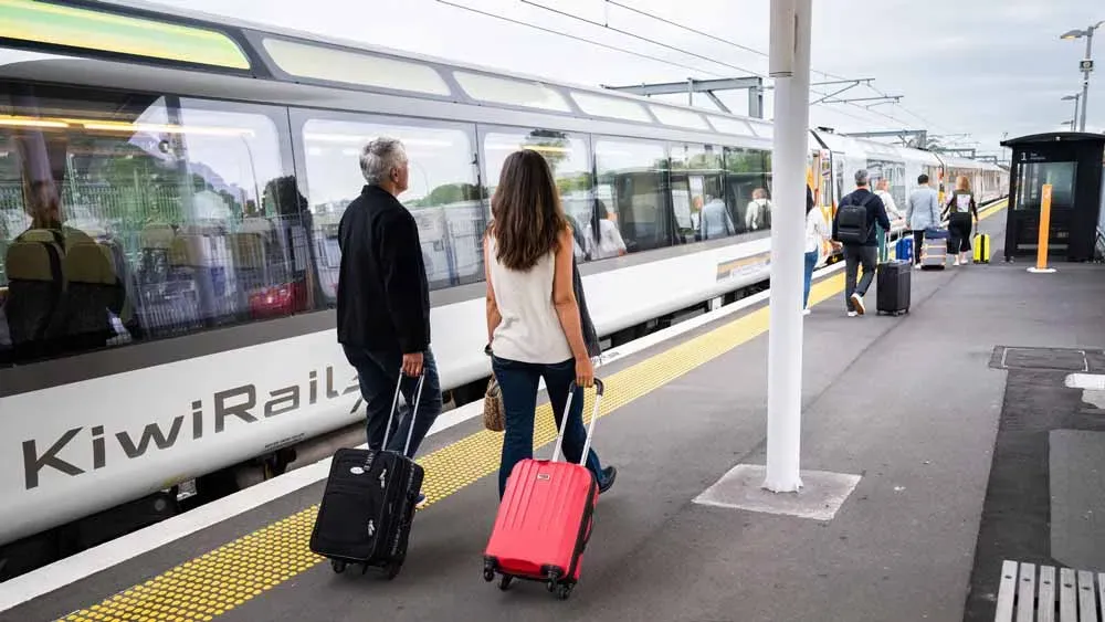 Northern Explorer passengers with suitcases on the station platform